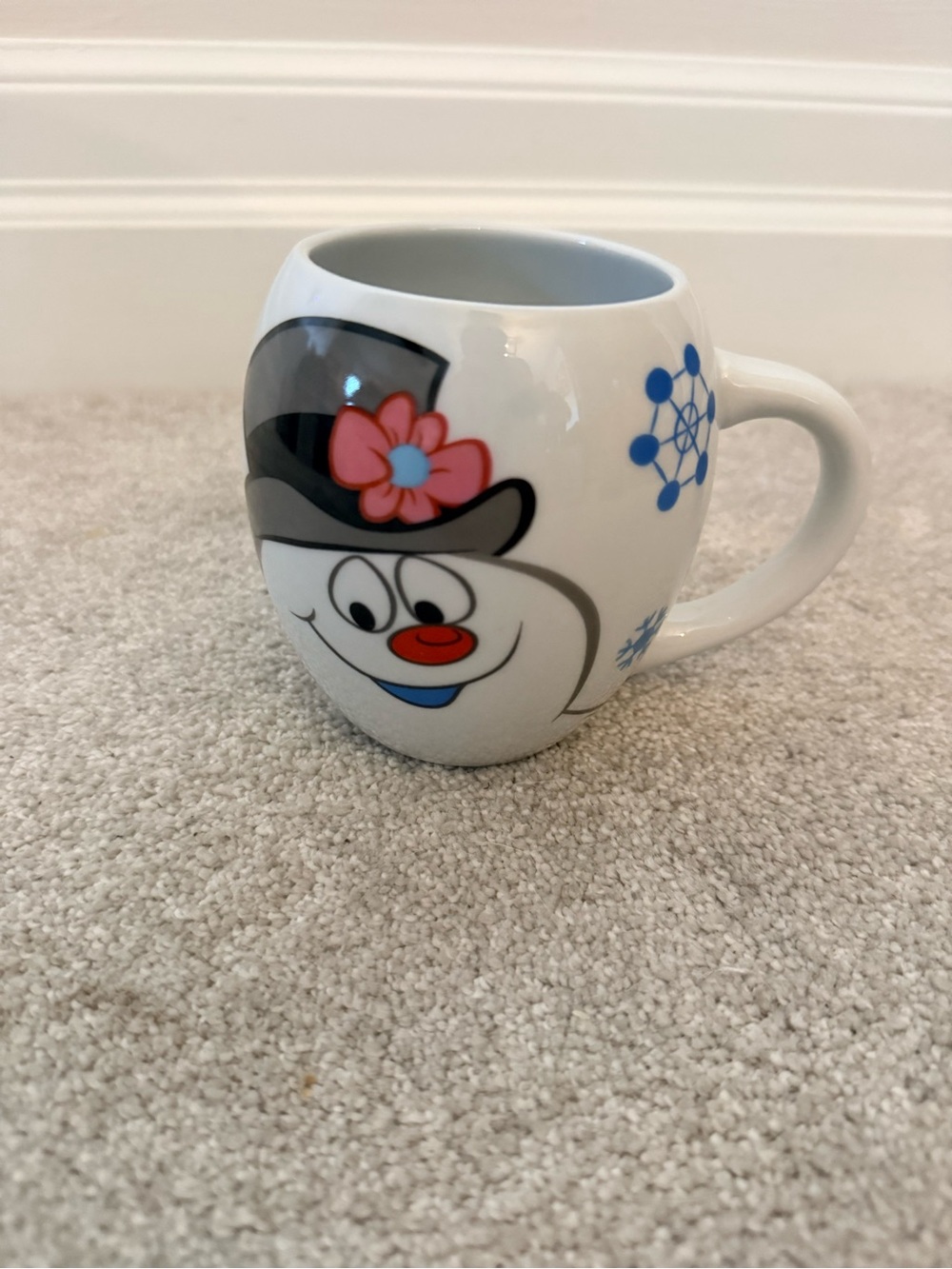 White frosty the Snowman Face Mug with Black Hat and Pink Flower